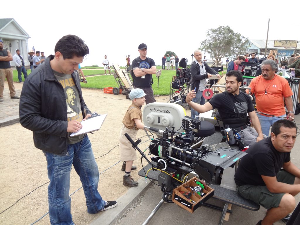 Behind the scenes of a film shoot with camera and crew